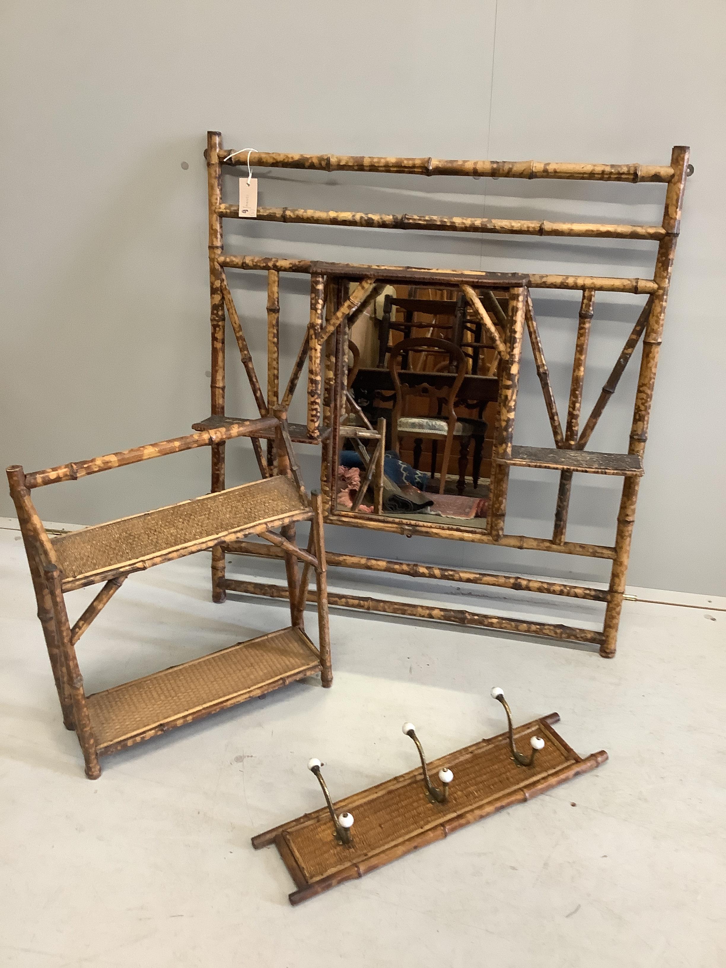 A late Victorian bamboo overmantel mirror, width 86cm, height 99cm together with a hanging coat rack and a two tier wall bracket